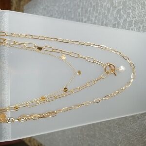 3 separate gold tone necklaces